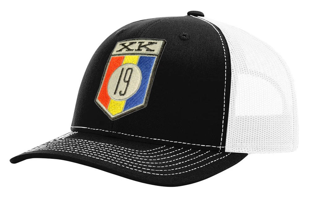 XK19 embroidered patch on a Richardson 112 Trucker style hat