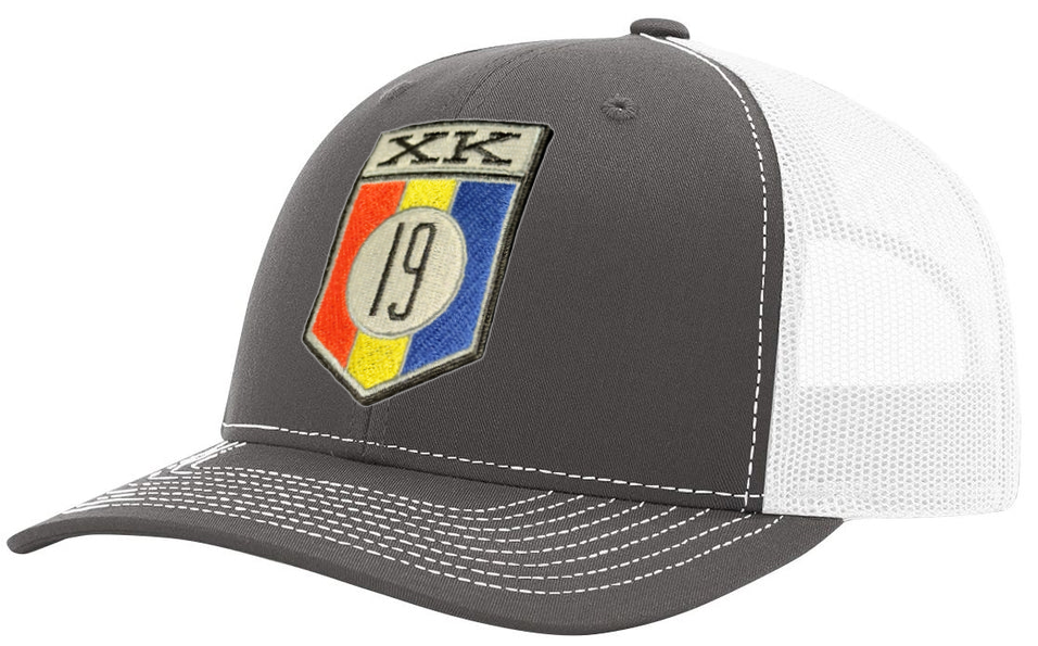 XK19 embroidered patch on a Richardson 112 Trucker style hat